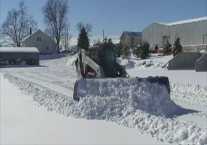 Telescoop skid loader snow plow
